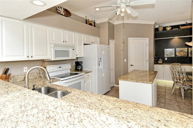 kitchen with crown molding, white appliances, white cabinetry, and sink