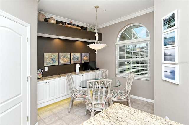 dining area featuring crown molding