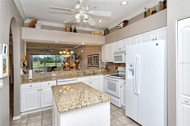 kitchen with white cabinetry, sink, white appliances, and kitchen peninsula