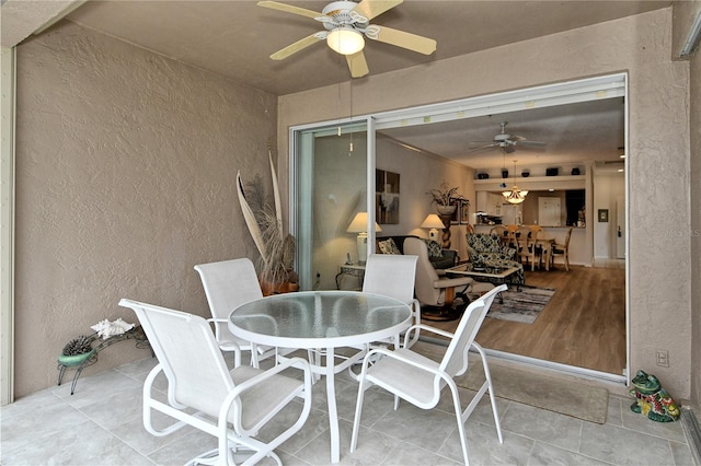 view of patio featuring ceiling fan