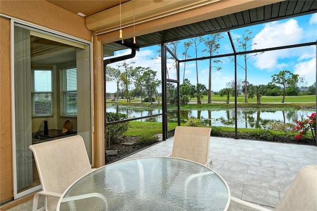 sunroom with a water view