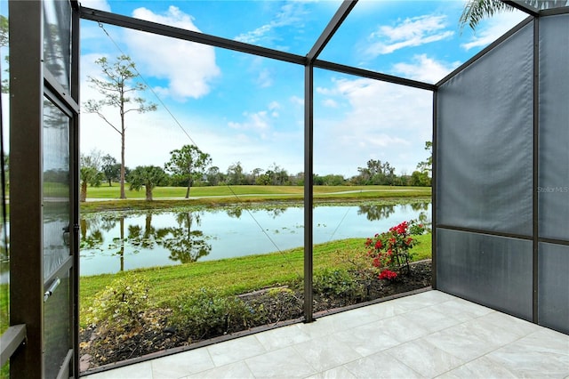 unfurnished sunroom with a water view