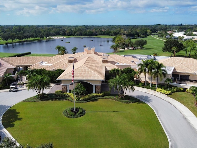 birds eye view of property with a water view