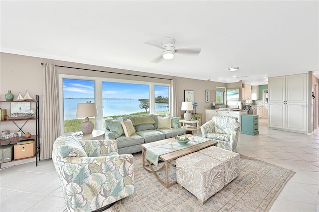 tiled living room featuring crown molding and ceiling fan