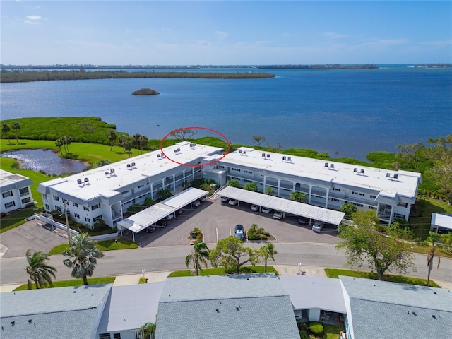 birds eye view of property with a water view