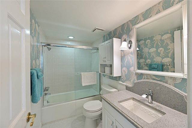 full bath with visible vents, toilet, enclosed tub / shower combo, vanity, and wallpapered walls