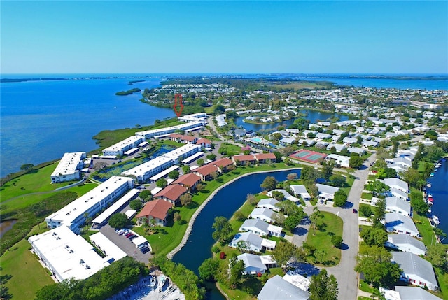 drone / aerial view with a residential view and a water view