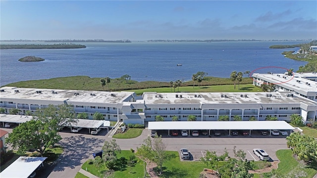 birds eye view of property featuring a water view