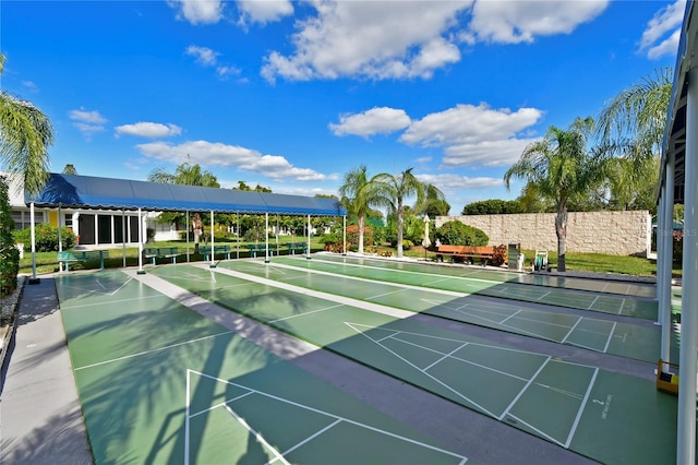 view of home's community featuring shuffleboard