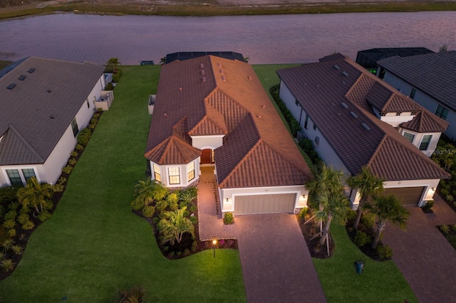 birds eye view of property featuring a water view