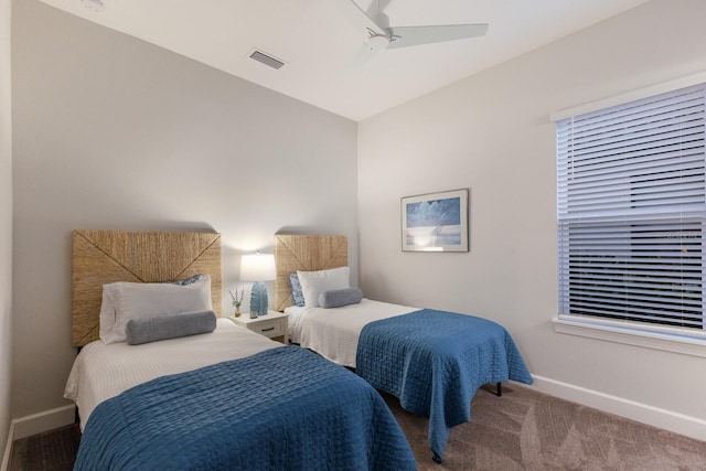 bedroom featuring ceiling fan and carpet