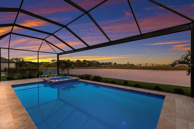 pool at dusk with a water view, a patio, an in ground hot tub, and glass enclosure