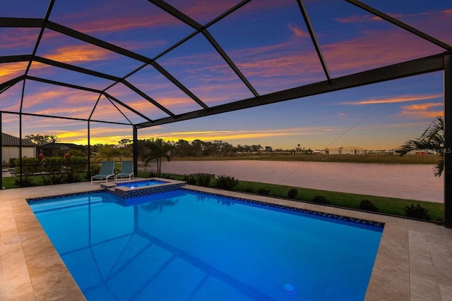 pool at dusk with a water view, an in ground hot tub, a lanai, and a patio