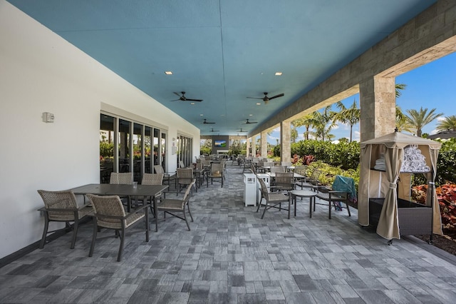 view of patio featuring ceiling fan