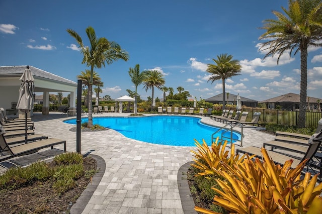 view of swimming pool featuring a gazebo and a patio area