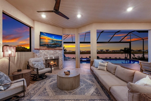 interior space with a patio area and an outdoor living space with a fireplace