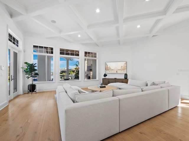 living room featuring beam ceiling, coffered ceiling, and light hardwood / wood-style floors