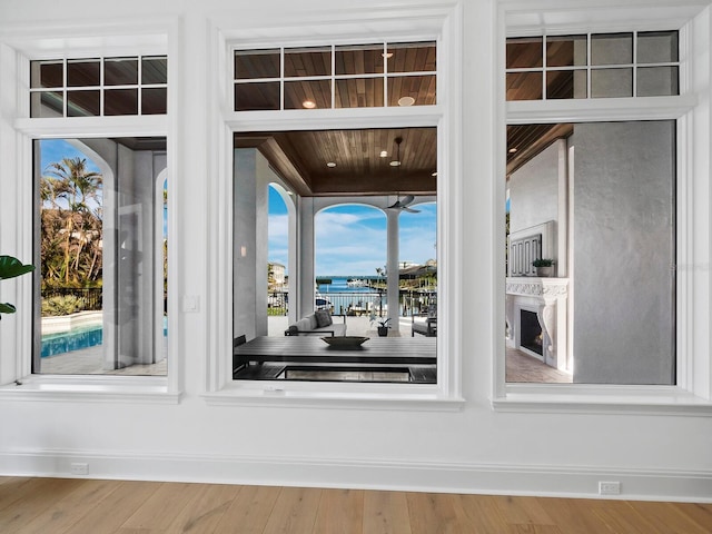 interior details featuring a water view and hardwood / wood-style floors