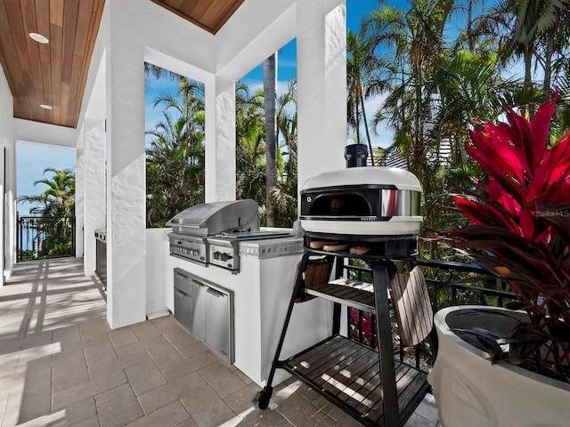 view of patio featuring area for grilling and exterior kitchen