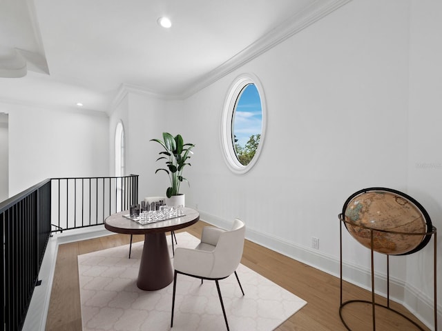 interior space featuring ornamental molding and light hardwood / wood-style floors