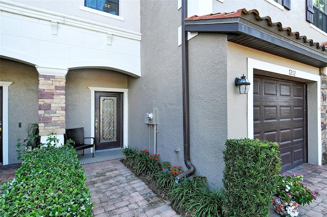 property entrance featuring a garage