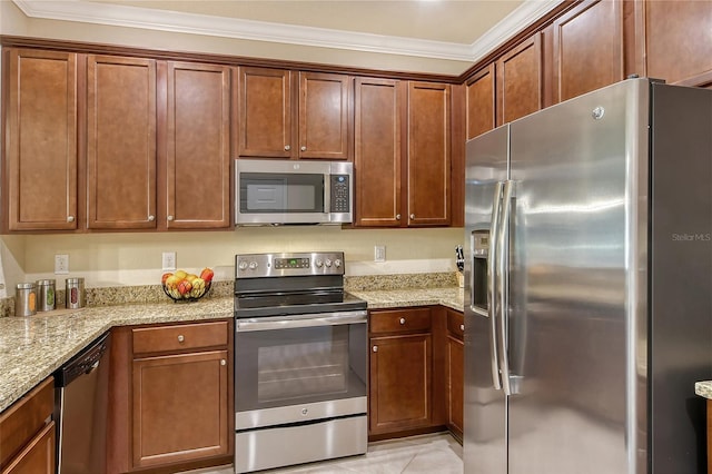 kitchen featuring light stone counters, ornamental molding, and stainless steel appliances