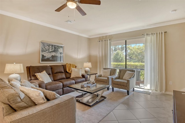 tiled living room featuring ornamental molding and ceiling fan