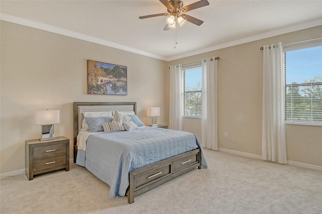 carpeted bedroom featuring ornamental molding and ceiling fan