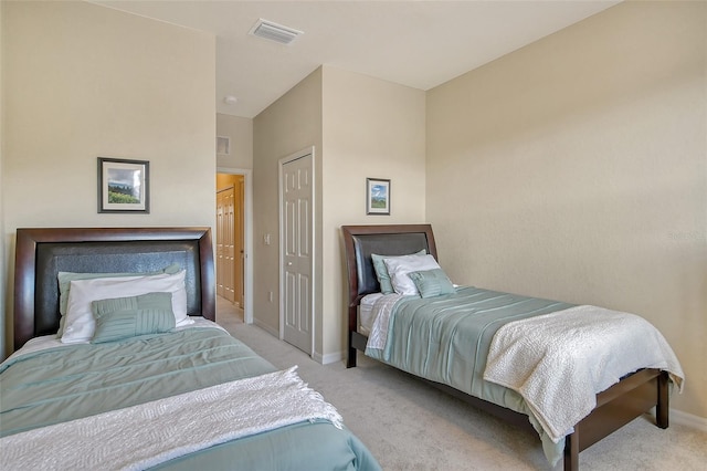 carpeted bedroom with a closet