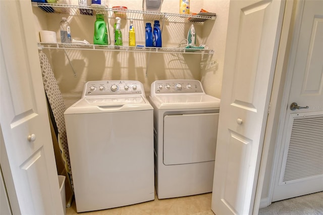 laundry room featuring washing machine and clothes dryer