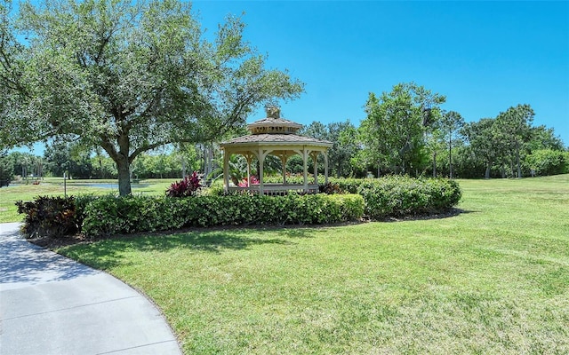 view of community featuring a gazebo and a lawn