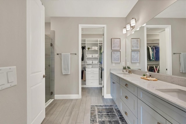 bathroom with vanity and an enclosed shower