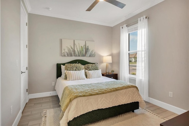 bedroom featuring hardwood / wood-style flooring, ceiling fan, and crown molding