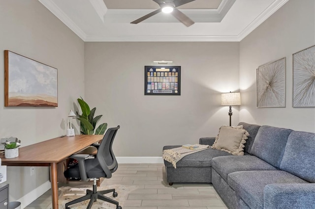 office with ceiling fan, ornamental molding, and a tray ceiling