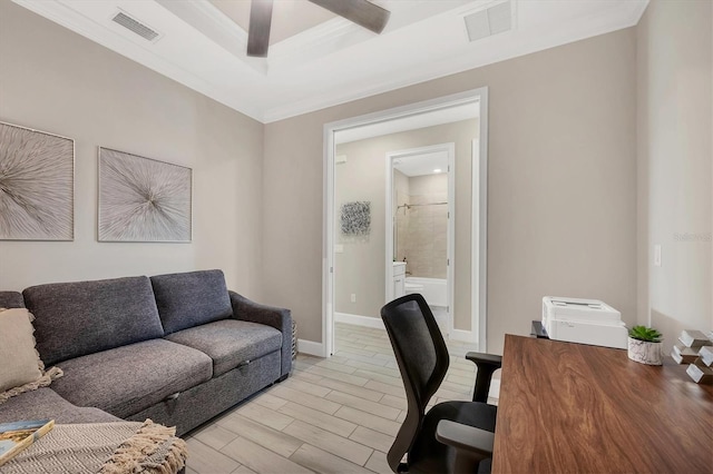 office with crown molding, ceiling fan, and a tray ceiling