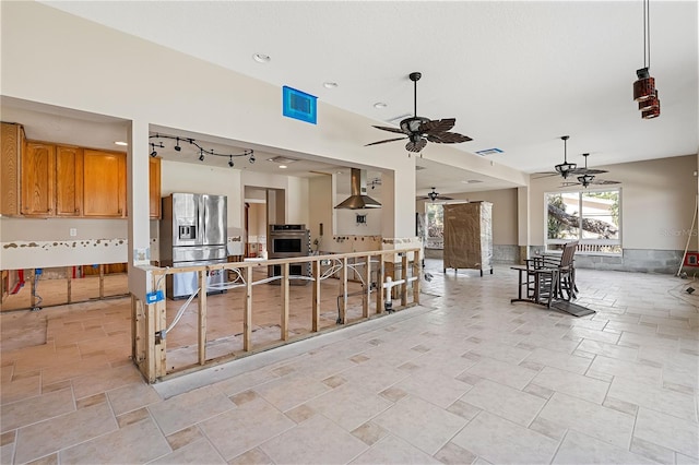 interior space with ceiling fan