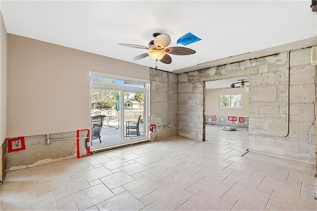 unfurnished room featuring ceiling fan