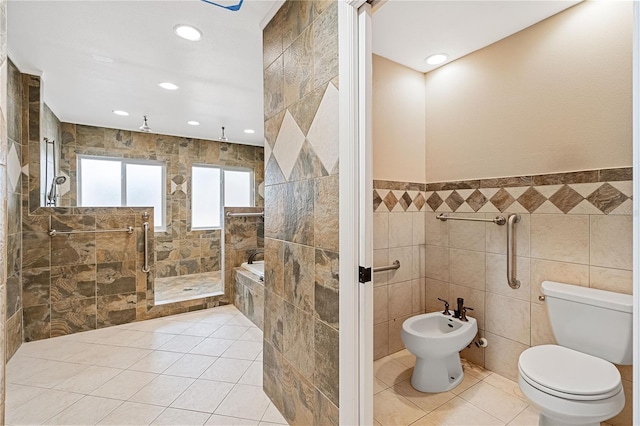 bathroom with a bidet, tile walls, a tile shower, tile patterned floors, and toilet