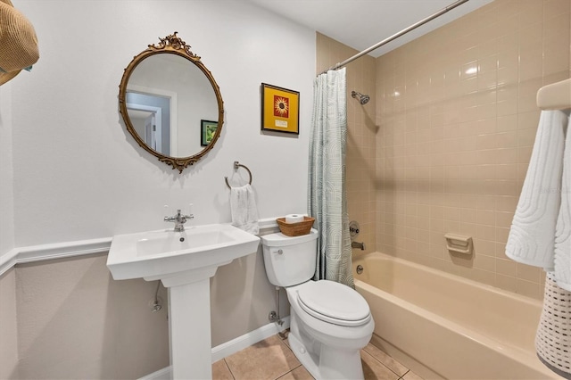 bathroom with tile patterned flooring, shower / bath combination with curtain, and toilet