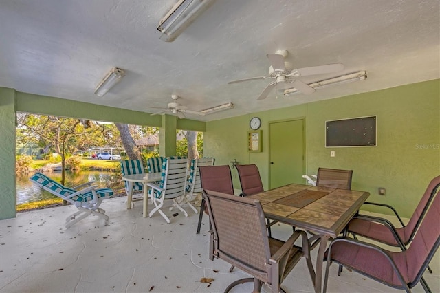 view of patio featuring ceiling fan