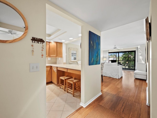 kitchen with decorative backsplash and light hardwood / wood-style flooring