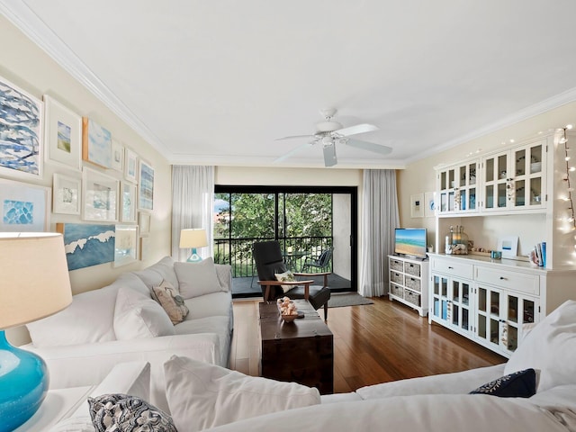 living room with ornamental molding, dark hardwood / wood-style floors, and ceiling fan