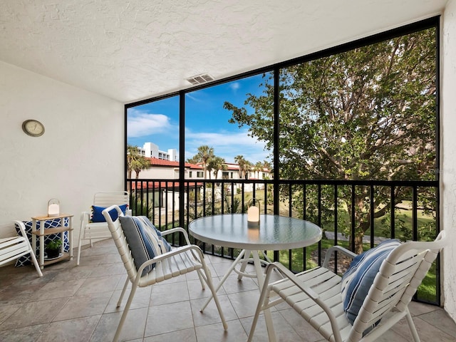 sunroom / solarium featuring plenty of natural light