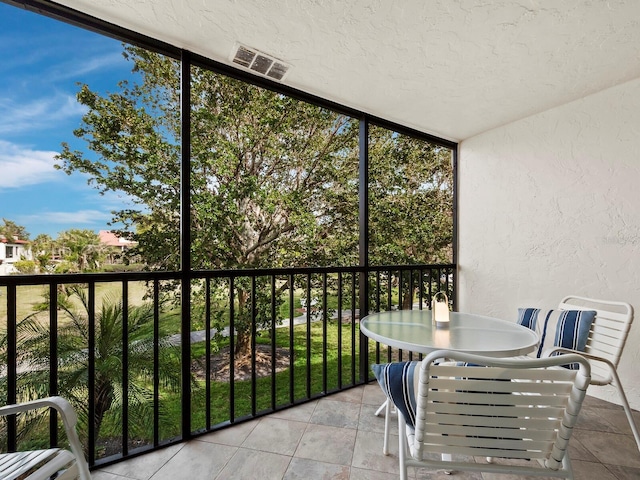 unfurnished sunroom featuring a wealth of natural light