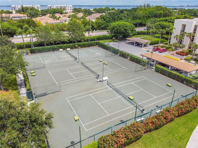 view of sport court featuring a water view