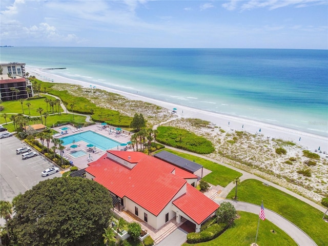 bird's eye view with a water view and a view of the beach