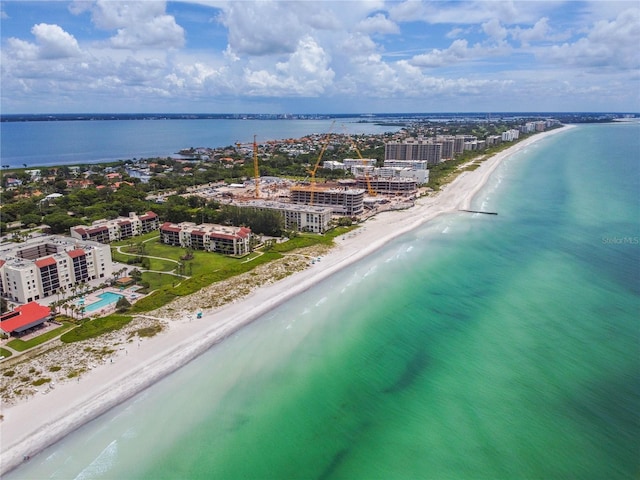 birds eye view of property featuring a view of the beach and a water view