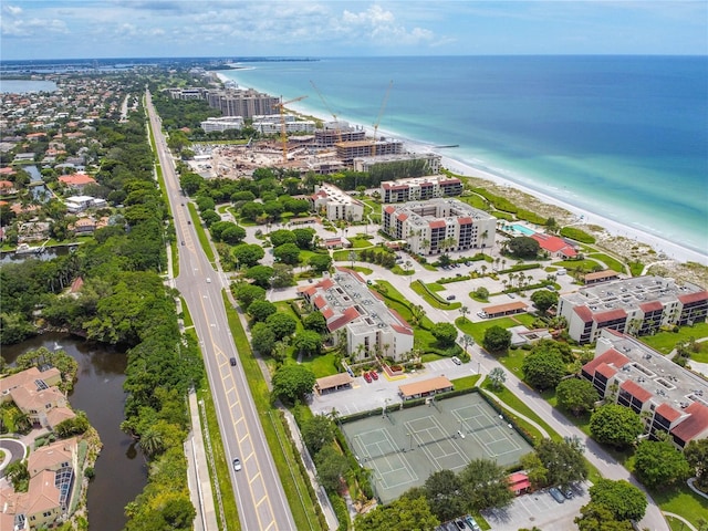 birds eye view of property featuring a water view and a view of the beach