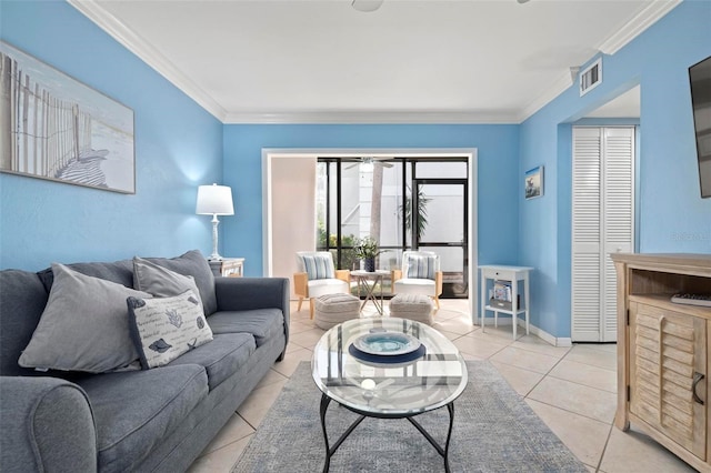 living room featuring visible vents, crown molding, baseboards, and light tile patterned floors