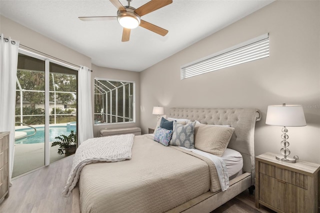 bedroom featuring wood finished floors, a ceiling fan, and access to exterior